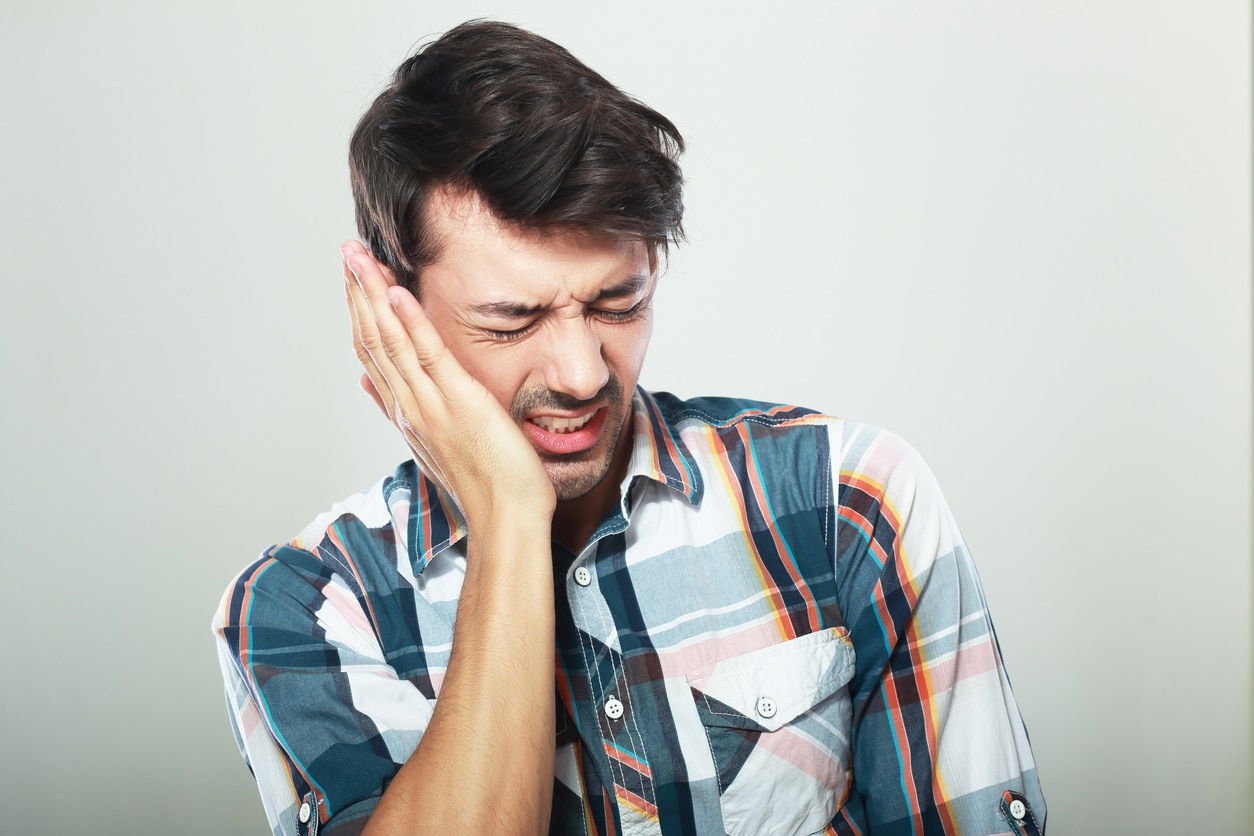 man have a horrible tooth pain suffer from illness
